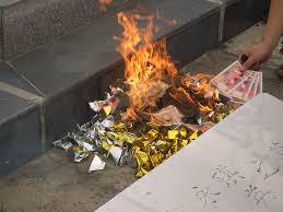 Chinese burning money for the dead.